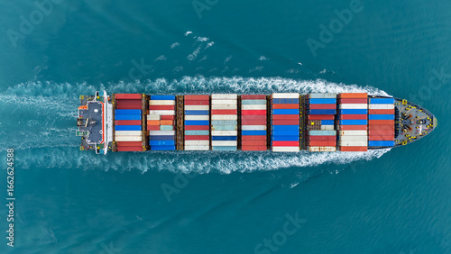 Aerial of cargo ship carrying container and running verry fast for export cargo from cargo yard port to other ocean concept smart freight shipping ship top view