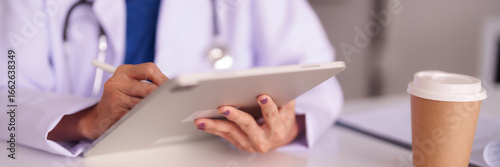 Doctor professional utilizes digital tablet for patient charting healthcare efficiency modern medical practice