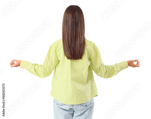Young woman meditating on w...