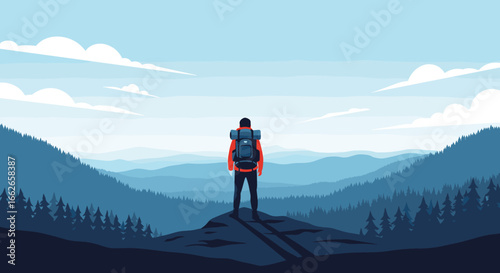 Solo traveler gazing at majestic misty mountain range under a vast blue sky