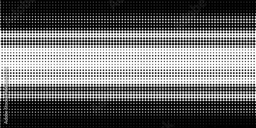 Grunge halftone gradient background. Faded dotted grit noise texture. Black and white rasterized sand wallpaper. Retro pixelated bitmap backdrop.