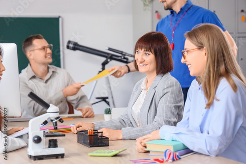 Female teacher with her col...