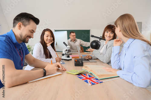 Group of teachers working a...