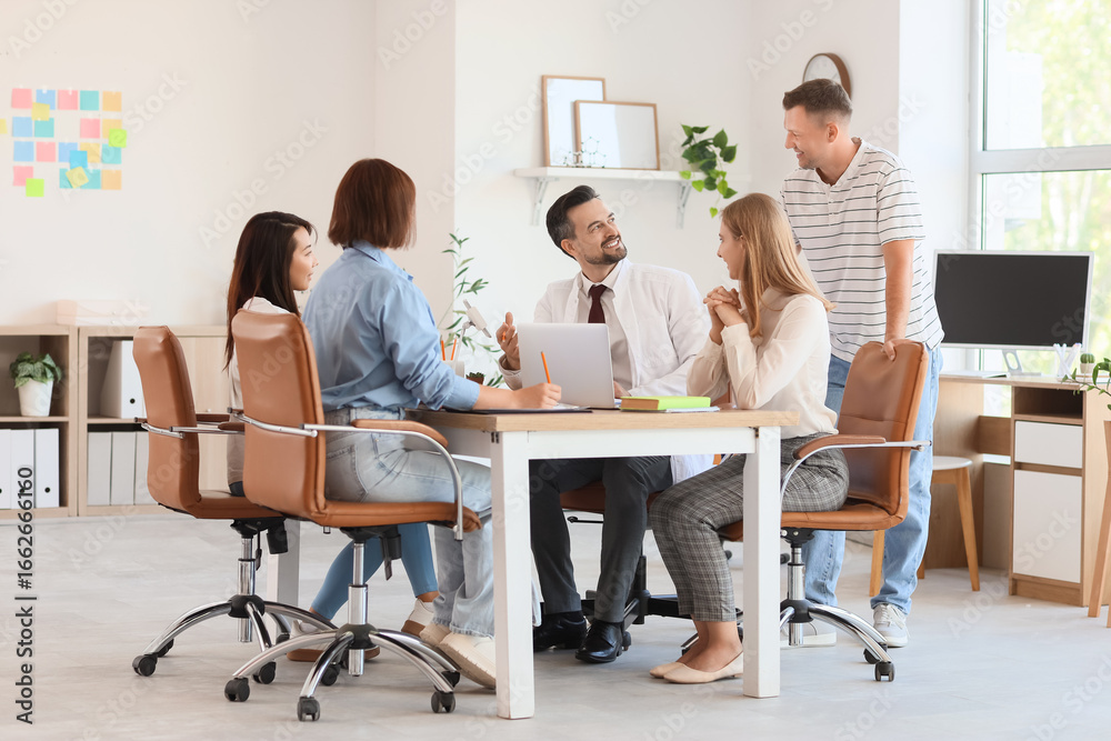 Obraz premium Group of teachers working at table in school office
