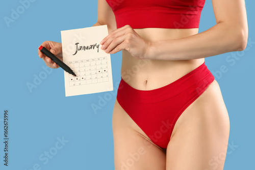 Young woman in panties with...