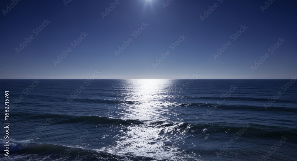 Obraz premium Silvery moonlight across sea expanse, ocean water surface with reflection, night casting blue toward horizon line