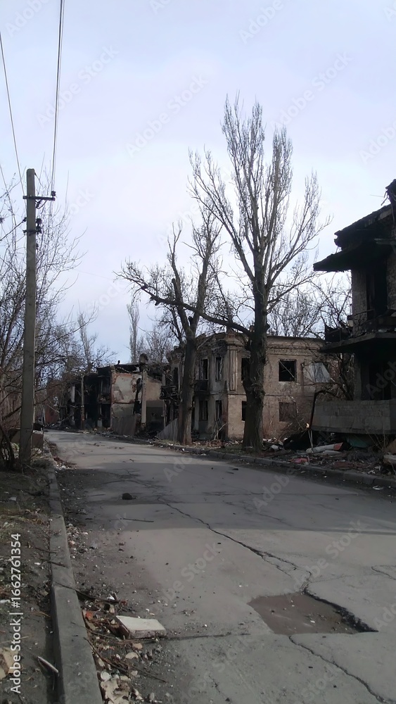 Fototapeta premium Destroyed city street, charred buildings