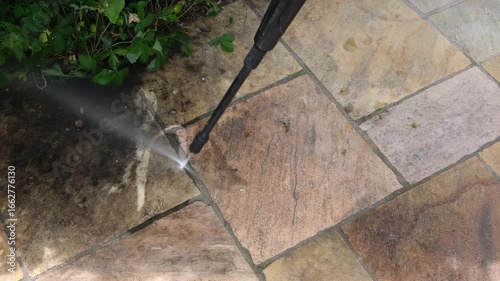Writing the word hello on stone slabs with a high-pressure cleaner