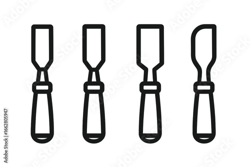 Various types of chisels displayed on a clean surface for woodworking or crafting