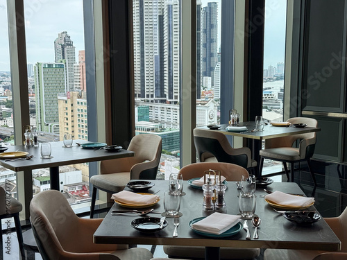 фотографія Bangkok, Thailand - June 30, 2025: Rooftop fine dining restaurant with panoramic