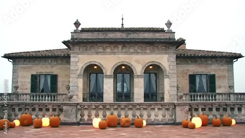 Rustic building terrace with pumpkin lamps