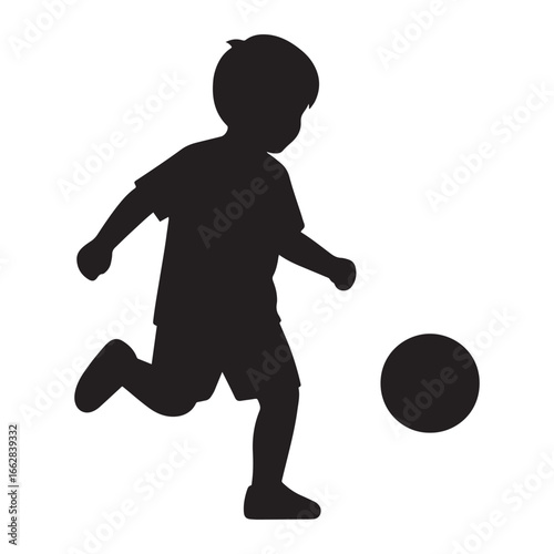 Silhouette of child playing soccer