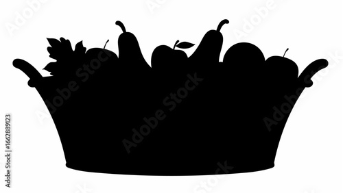 Silhouette of a bucket filled with fruits including apples pears and leaves in a dark color palette