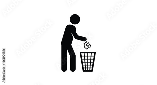 A person throwing crumpled paper into a trash bin