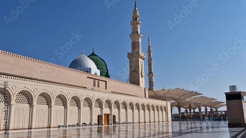 Static view of green and silver dome of Nabawi mosque in Medina, Saudi Arabia. 