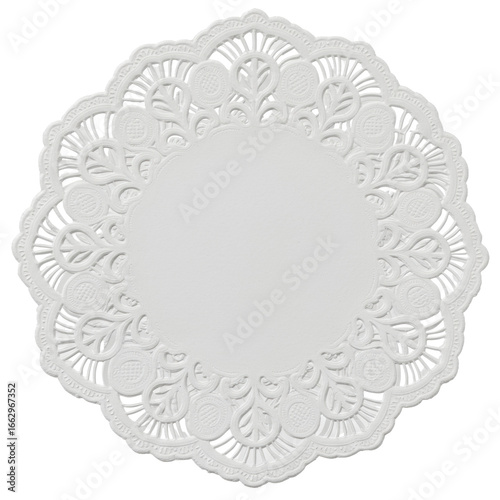 A single, transparent paper doily with intricate lace-like cut-out patterns, perfectly circular, on a stark white seamless studio background, top-down, macro view Concept of elegant simplicity and