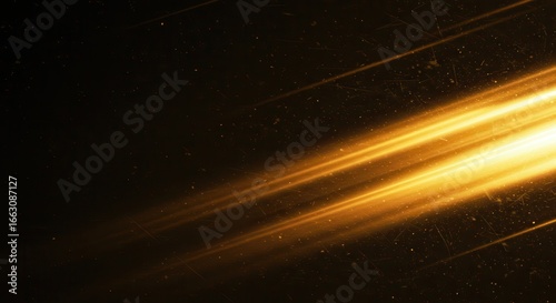 Golden light streaks create a dynamic and abstract background with a sense of speed and motion blur effect