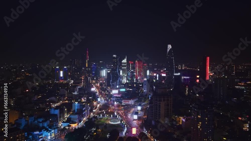 Wallpaper Mural Aerial night view Ho chi minh city or Saigon in Vietnam, illuminated of business center with skyscrapers. Torontodigital.ca