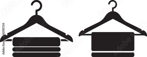 Two clothes hangers with folded towels silhouette
