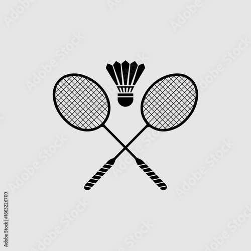 Two crossed badminton rackets and shuttlecock silhouette isolated on white background