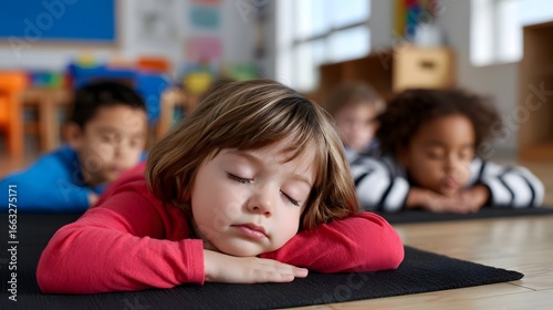 A young student resting in a classroom