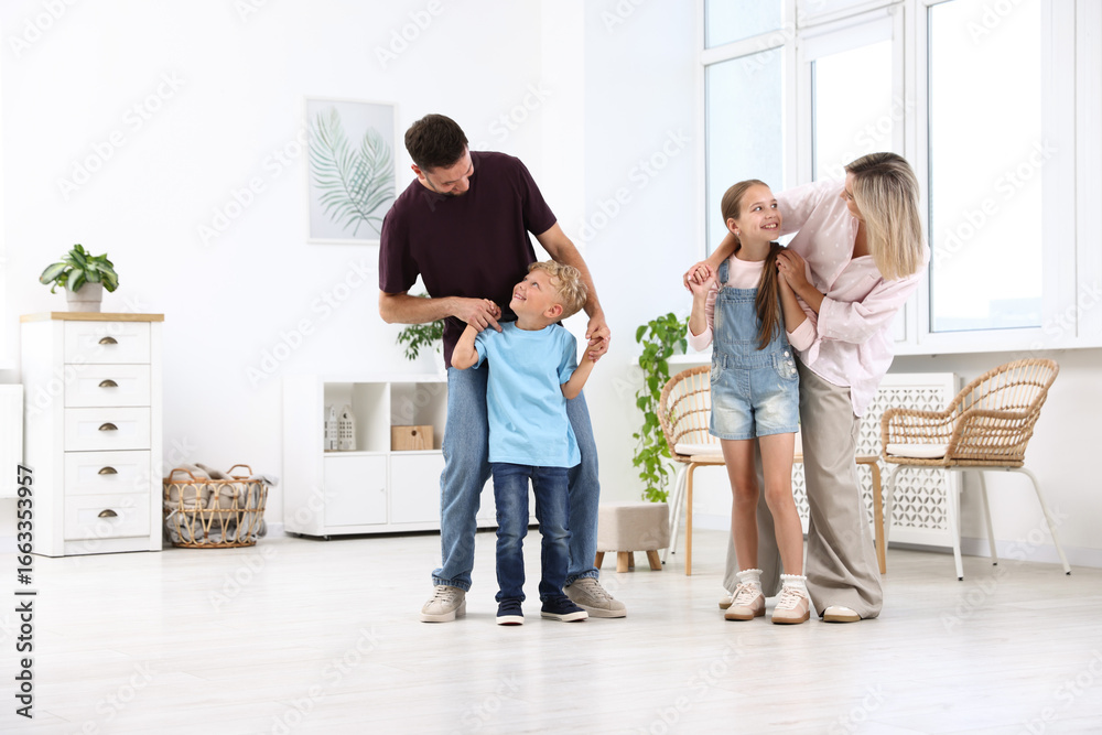 Fototapeta premium Happy family spending time together in light room