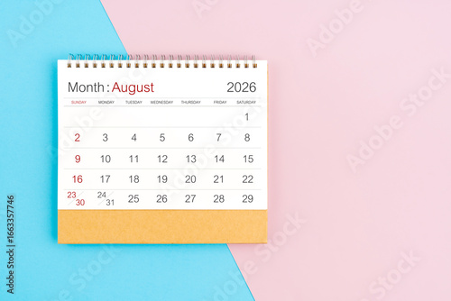 August 2026 desk calendar on blue and pink color background, with copy  space.