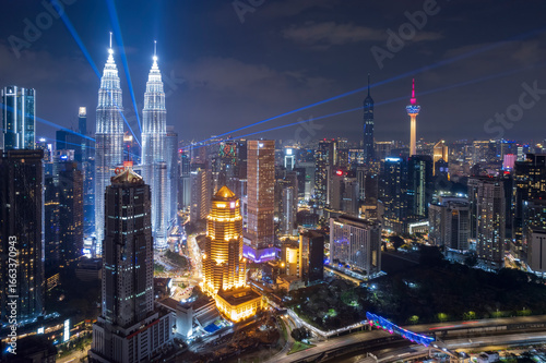 Urban sprawl unfolds beneath a canopy of night lights