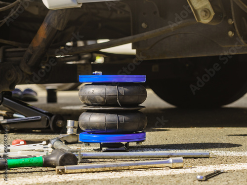 Car in service. Installing air ride suspension.