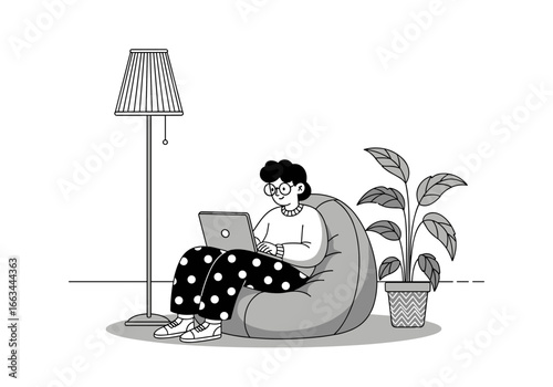A person comfortably working on a laptop while sitting in a large beanbag chair with a floor lamp and a potted plant nearby