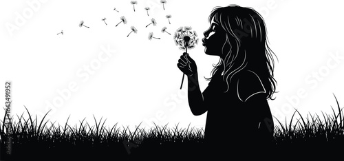 Silhouette of a young girl blowing dandelion seeds in a grassy field flying