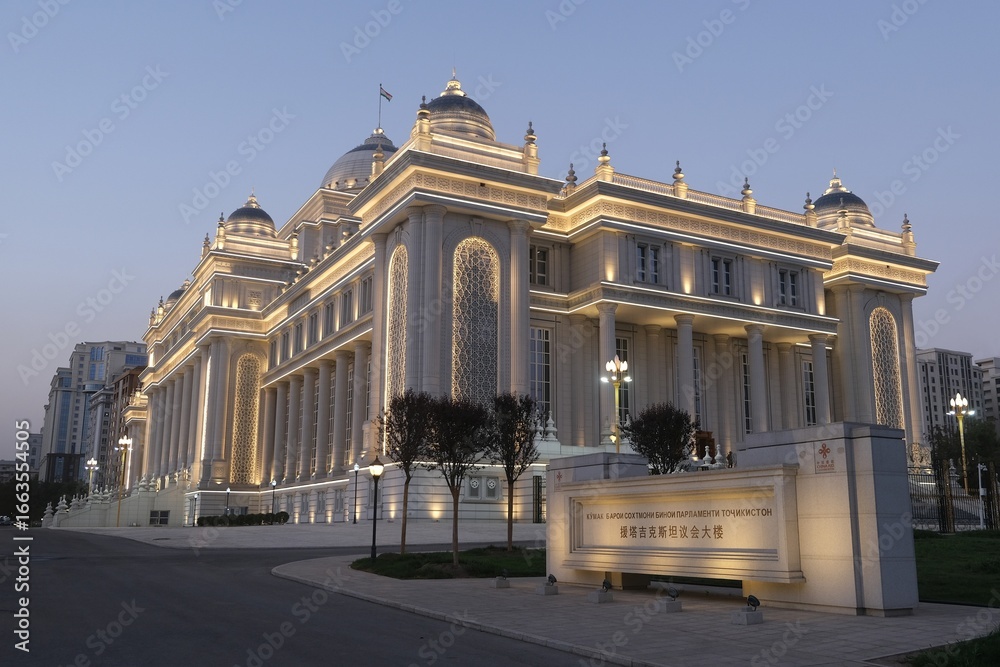 Obraz premium Dushanbe, Tajikistan - Scenery of center of Dushanbe, capital of Tajikistan. New building of the Parliament of Tajikistan with evening illuminations.