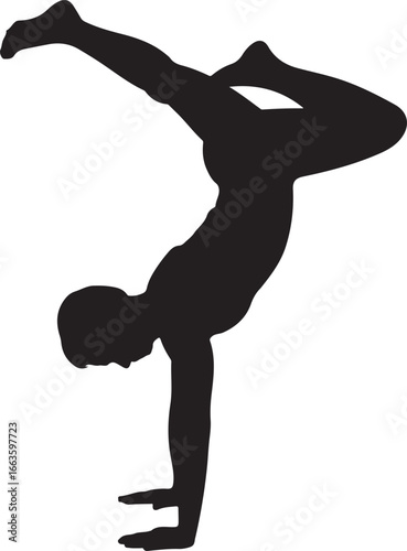 Silhouette of a person performing a handstand with legs extended