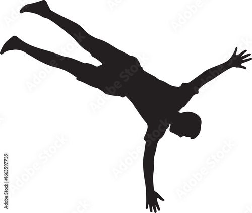 Silhouette of a person performing a handstand with legs in the air