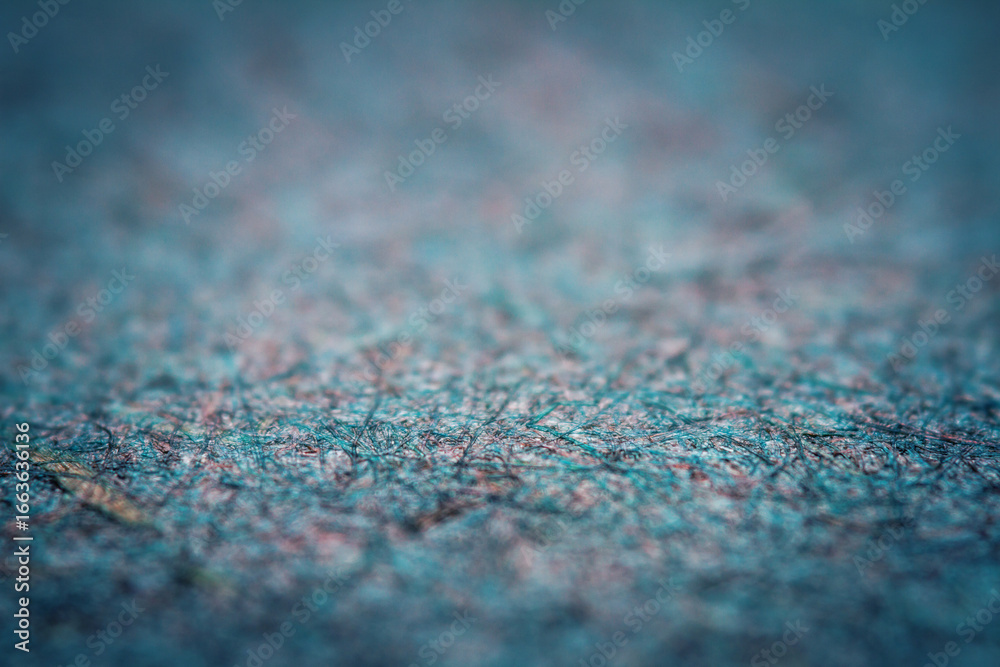 Obraz premium Extreme closeup of turquoise handmade paper with shallow depth of field.