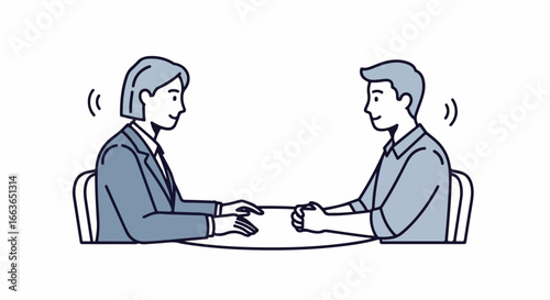 Two people having a conversation at a table.