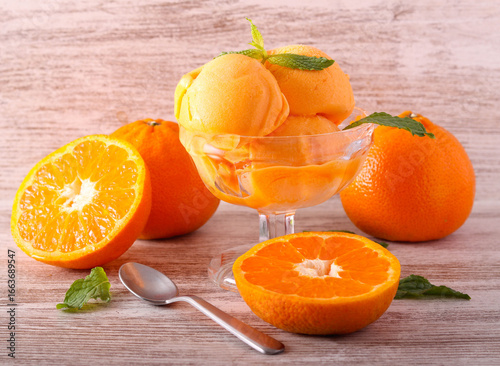 Photography Tangerine sorbet scoops, served