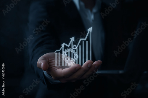Digital transformation concept for business success, illustrating growth, innovation, and strategic planning through a futuristic graph held in a hand