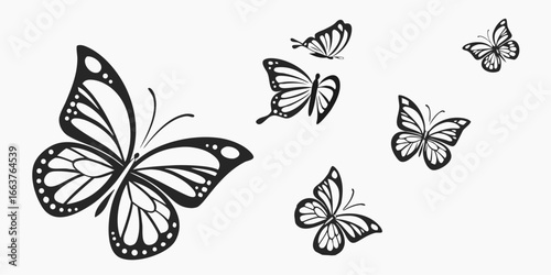 Collection of Stylized Black Butterflies in Flight