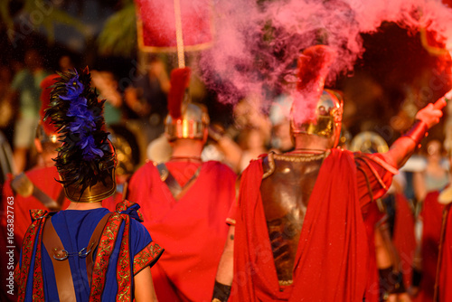 Photography A Roman Soldier with a Red Smoke Flare at a Festival