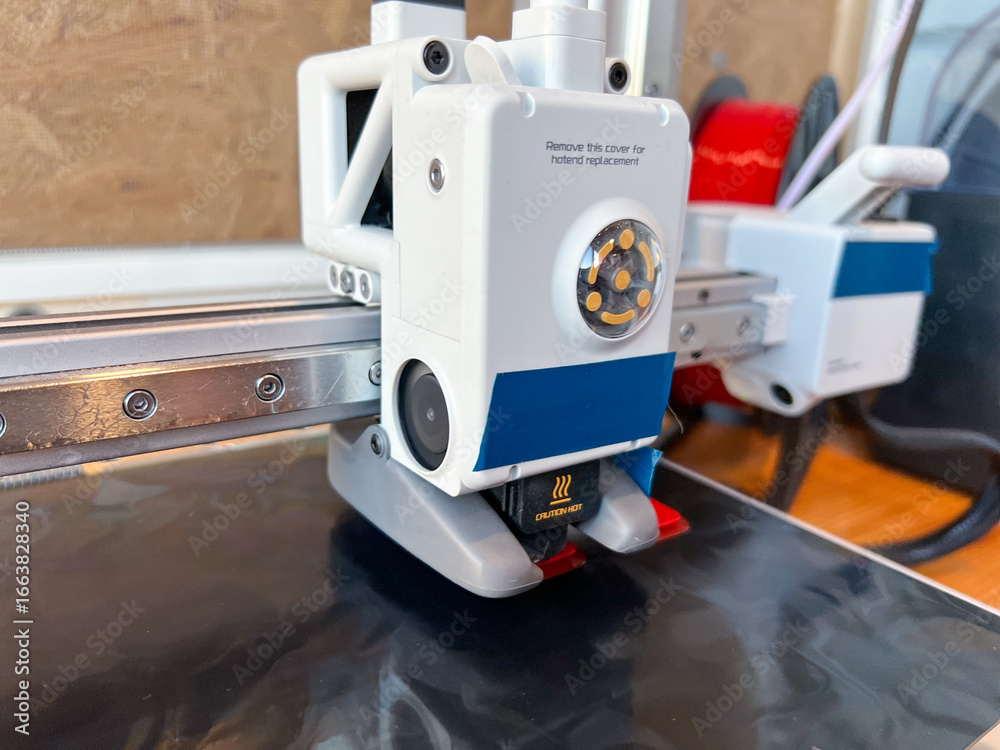 Fototapeta premium 3d printer extruder creating an object layer by layer
