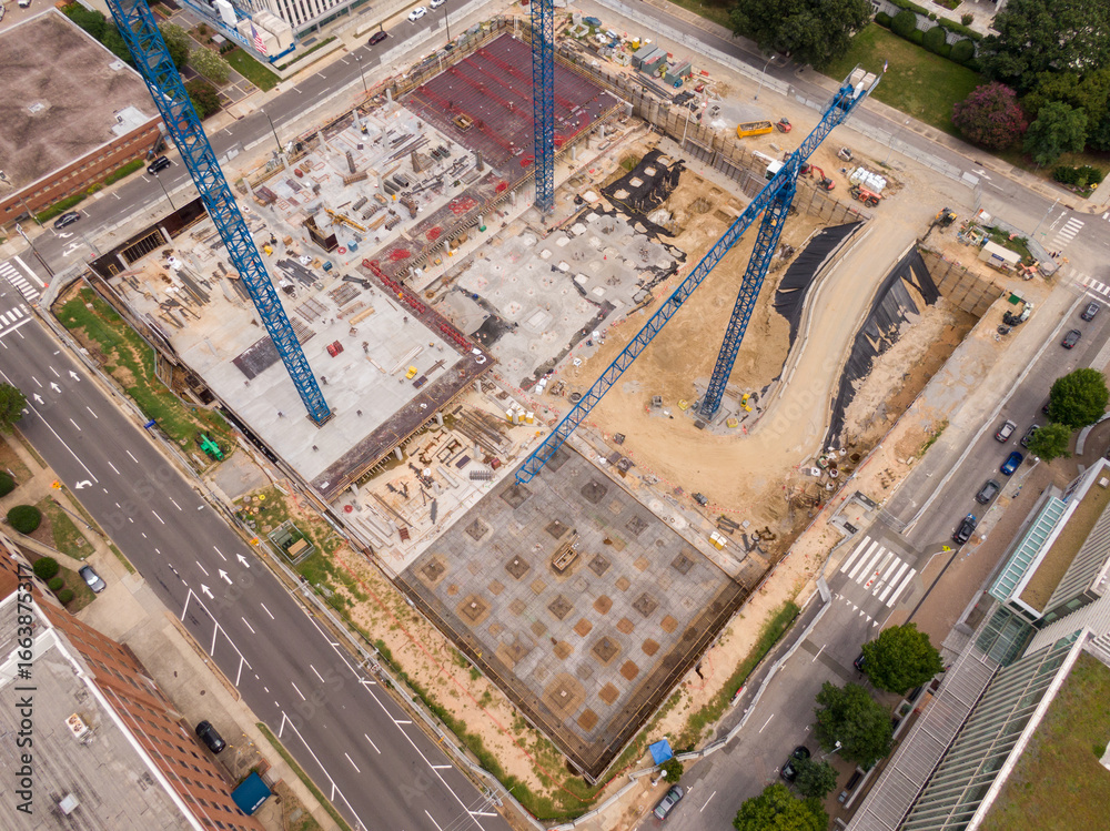 Fototapeta premium Day Time Drone Images of a High Rise Construction Site in Downtown Raleigh North Carolina on a Cloudy Day.