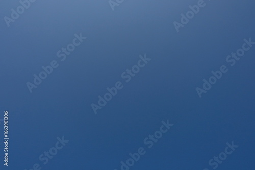 Clear blue sky with bright natural light. Perfect background for nature, freedom, peace, and environmental concepts. Ideal for use in design, travel, and outdoor themes