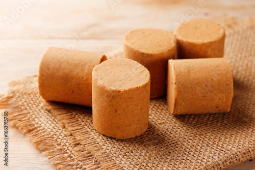 Brazilian peanut candy, traditionally known as pacoca or pacoquinha, on a wooden table
