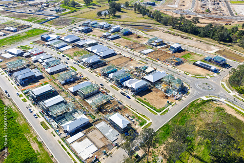 Drone aerial photograph of new houses under construction in the fast growing suburb of Oran Park in the Macarthur Region of South Western Sydney in New South Wales, Australia. 