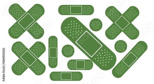 Collection of green adhesive bandages in various shapes and sizes on a clean background