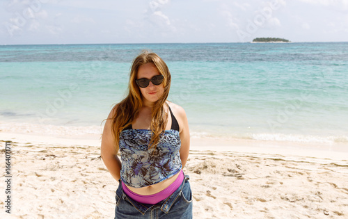 Side View of a Woman Pondering on a Beautiful Beach