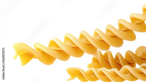 Close-up of uncooked fusilli pasta spiral noodles on white background