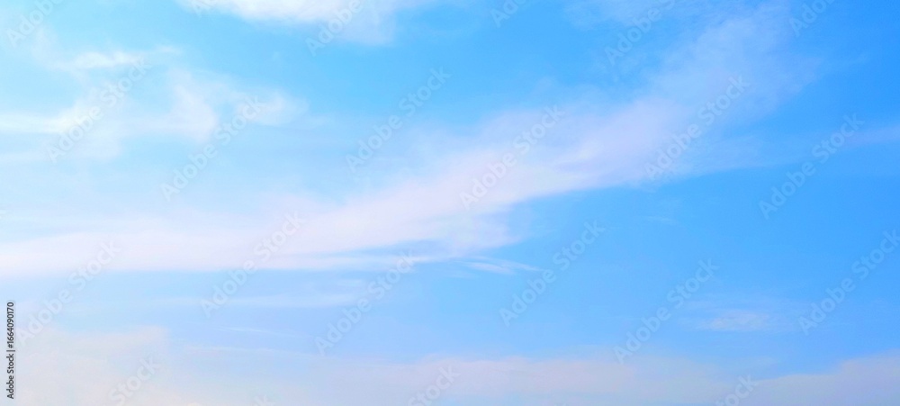 Obraz premium Panorama view of bright blue sky with fluffy white clouds on a clear sunny day. Sky panorama clear blue with white clouds in spring. Cloudscape