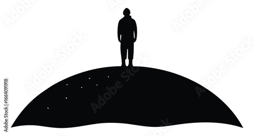 Silhouette of a figure standing on a dark hill in isolation